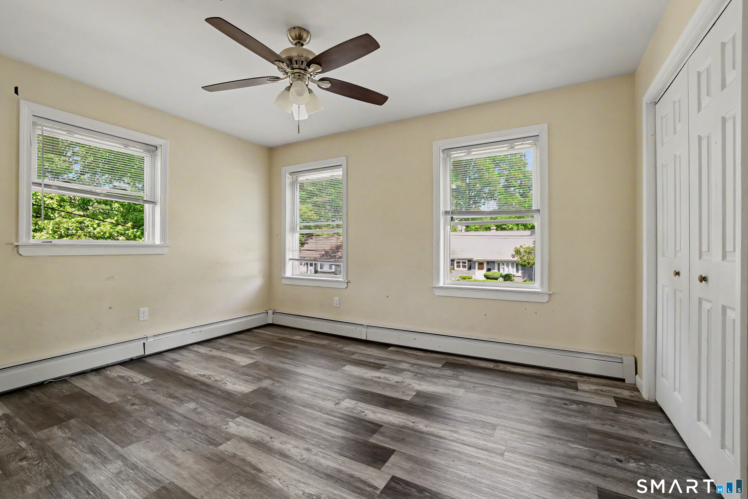 97 Boothbay Street Bloomfield, CT 06002 - Photo 26 of 33 a view of an empty room with wooden floor and a window