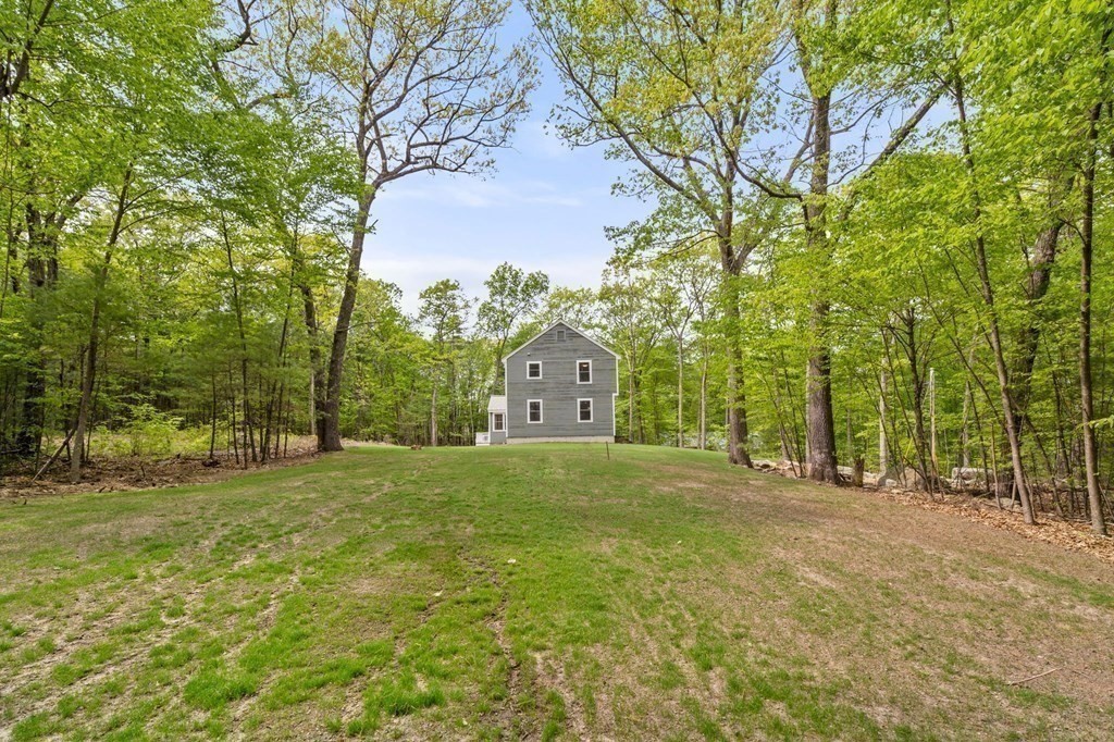 93 Spectacle Hill Road Bolton, MA 01740 - Photo 40 of 42 a big yard with large trees