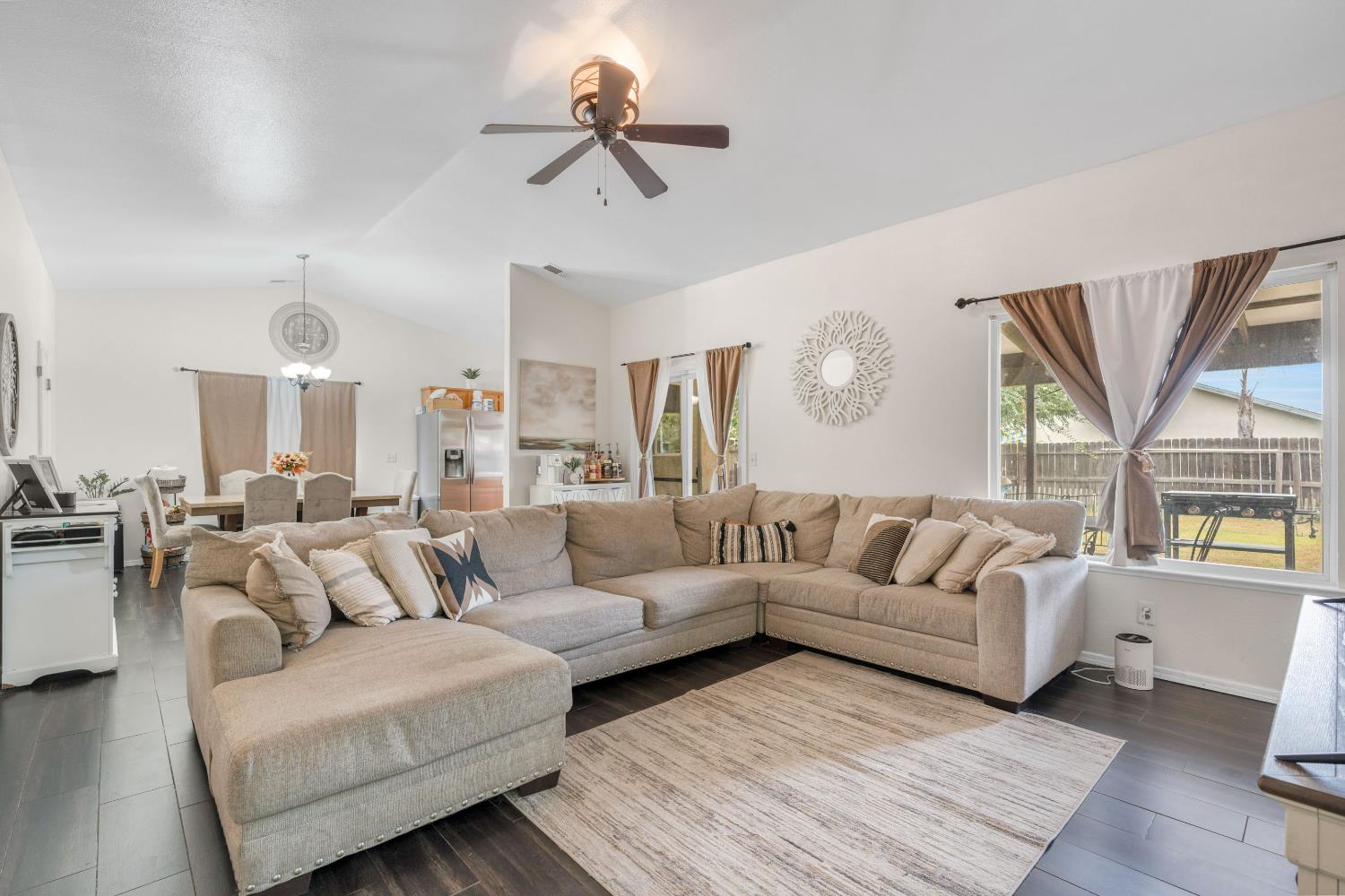 525 Tucker Sanger, CA 93657 - Photo 2 of 13 a living room with furniture ceiling fan and a window