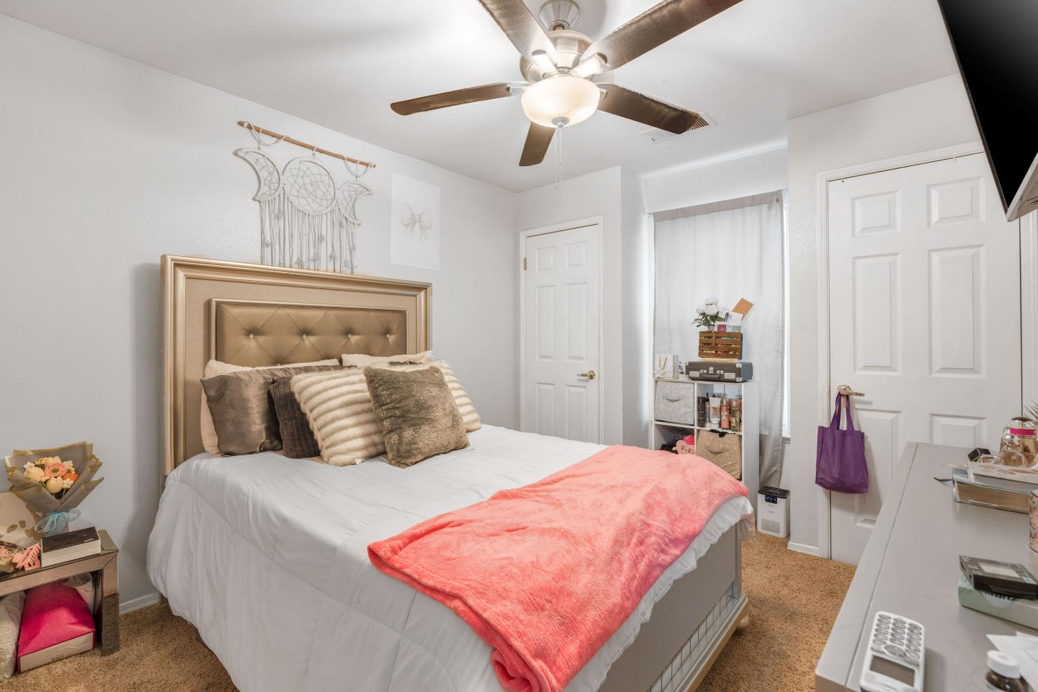 525 Tucker Sanger, CA 93657 - Photo 7 of 13 a bedroom with a bed and a chandelier