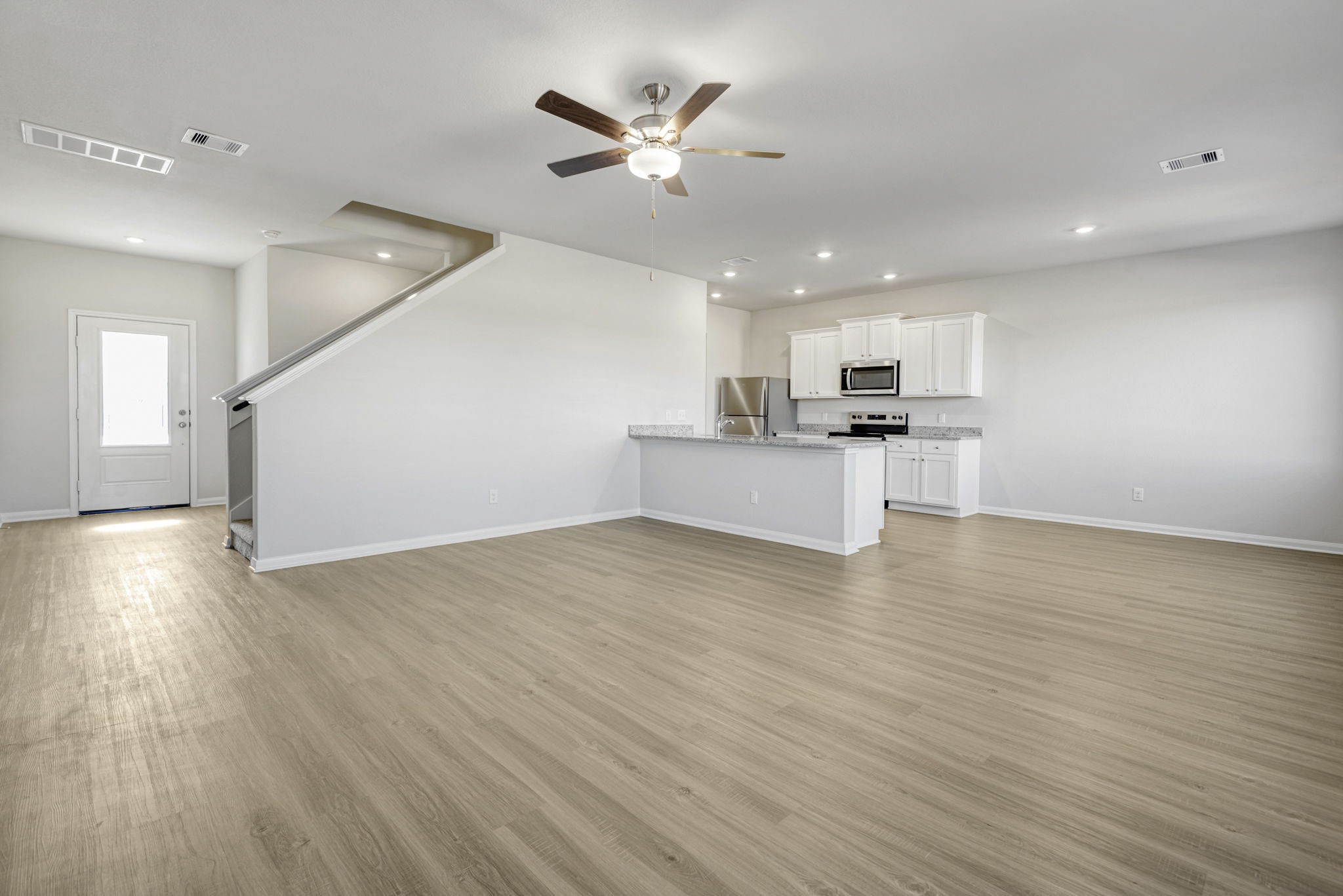 6410 Winter Elm Street Houston, TX 77048 - Photo 2 of 7 Spacious living room, open to the kitchen and dining area.