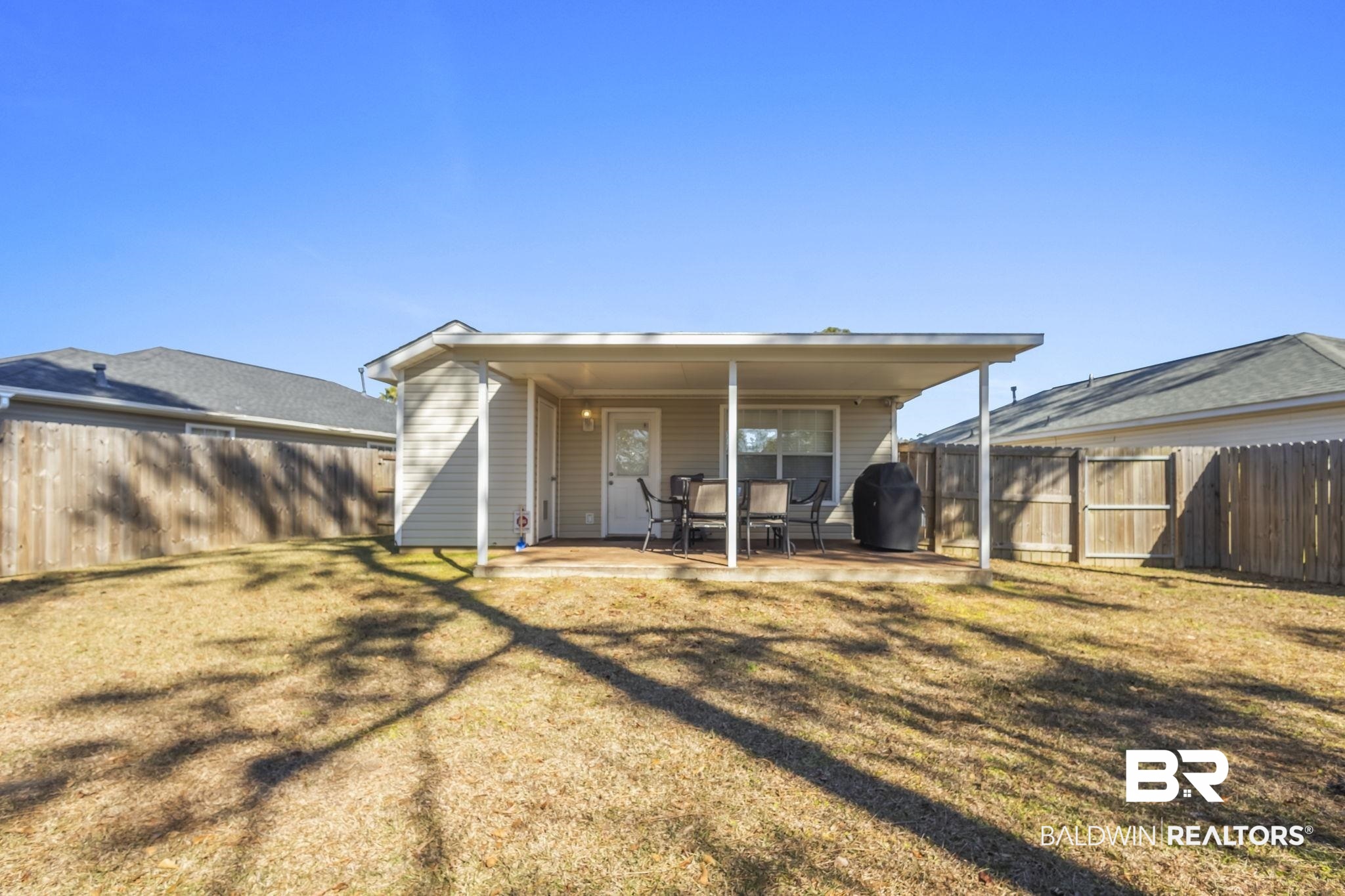 7946 Audubon Drive Foley, AL 36535 - Photo 24 of 25 Rear view of property with a yard and a patio area