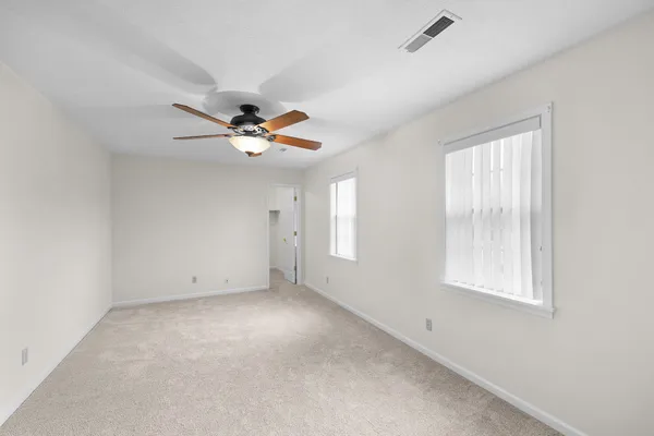 a view of an empty room with a window