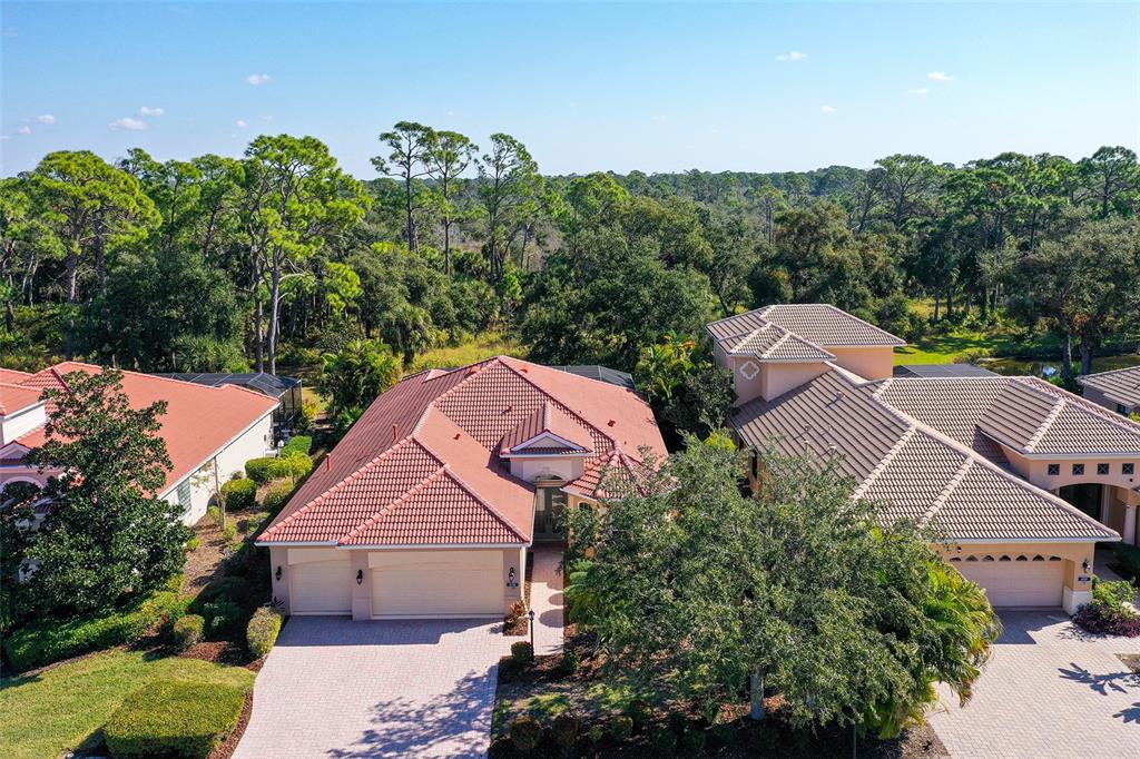 an aerial view of multiple houses with yard
