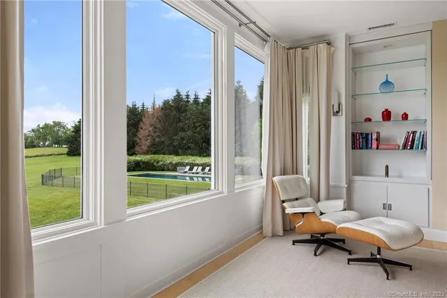a living room with furniture and a window