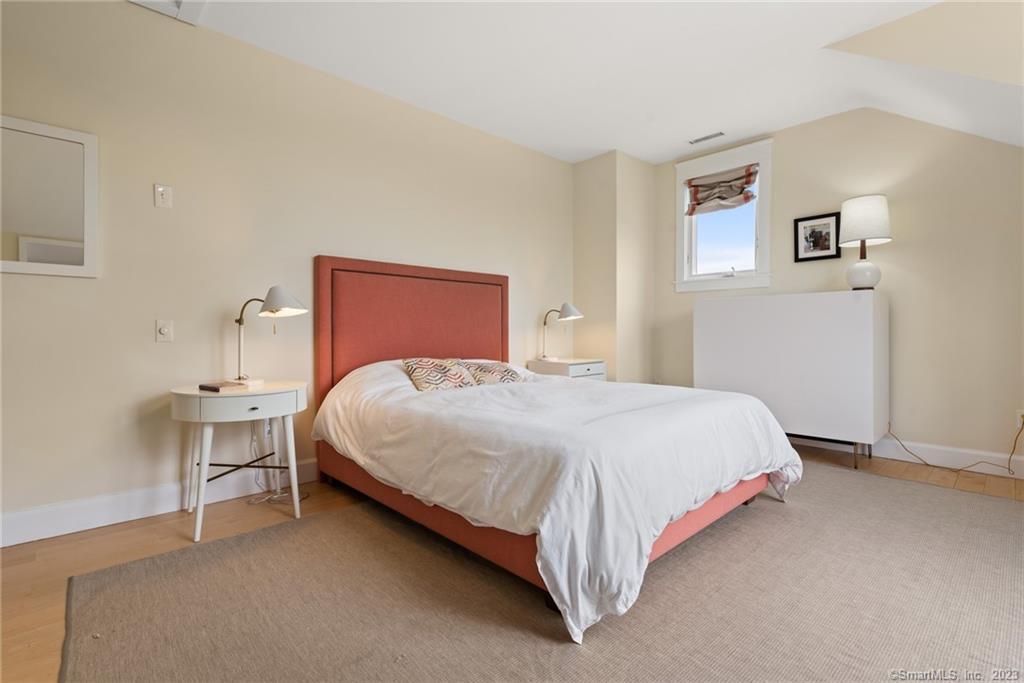 141 Geer Mountain Road South Kent, CT 06785 - Photo 15 of 33 a bedroom with a bed and painting on the wall