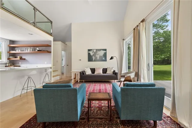 a living room with furniture and a window