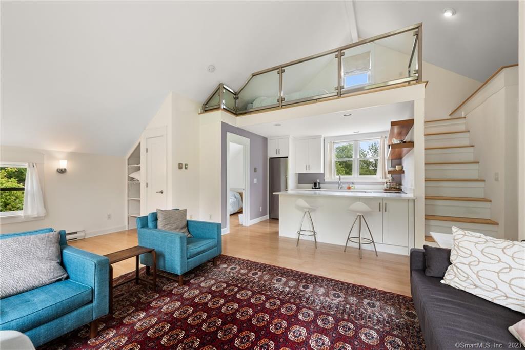 141 Geer Mountain Road South Kent, CT 06785 - Photo 27 of 33 a living room with furniture and a wooden floor