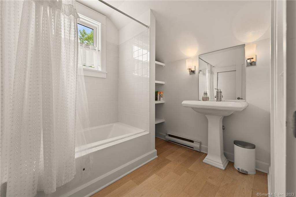 141 Geer Mountain Road South Kent, CT 06785 - Photo 31 of 33 a bathroom with a sink a toilet and shower