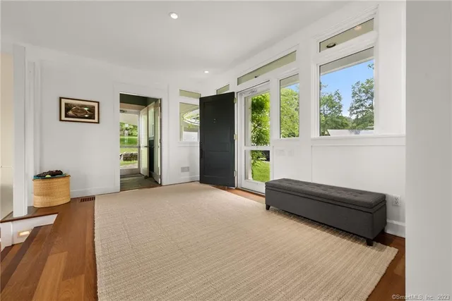 a spacious bedroom with a bed and a window