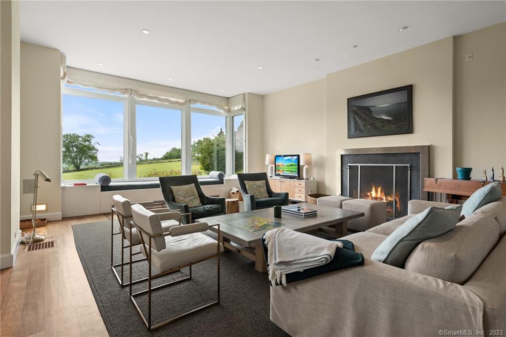 141 Geer Mountain Road South Kent, CT 06785 - Photo 6 of 33 a living room with furniture large window and a fireplace