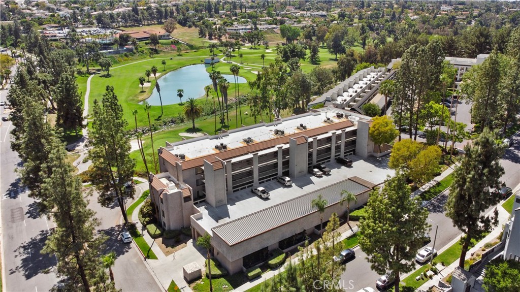 5555 Canyon Crest Drive, Unit 1F Riverside, CA 92507 - Photo 24 of 27 an aerial view of a house with a yard