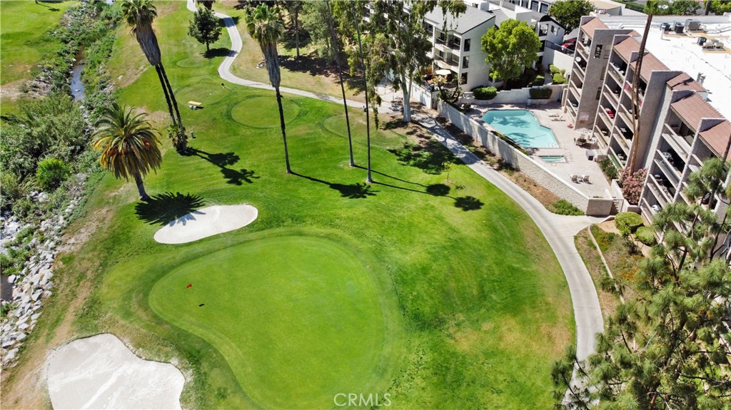 5555 Canyon Crest Drive, Unit 1F Riverside, CA 92507 - Photo 25 of 27 a green field with lots of trees