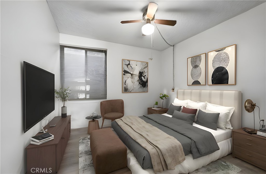 5555 Canyon Crest Drive, Unit 1F Riverside, CA 92507 - Photo 5 of 27 a bedroom with bed tv and window