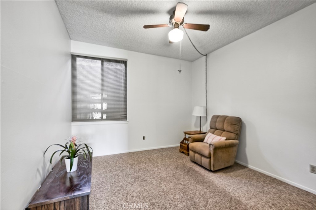 5555 Canyon Crest Drive, Unit 1F Riverside, CA 92507 - Photo 6 of 27 a living room with furniture