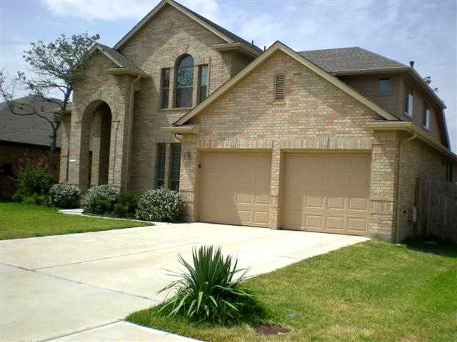 7212 Moon Rock Road Austin, TX 78739 - Photo 1 of 1 a front view of a house with garden