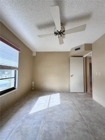 a view of a hallway with a chandelier