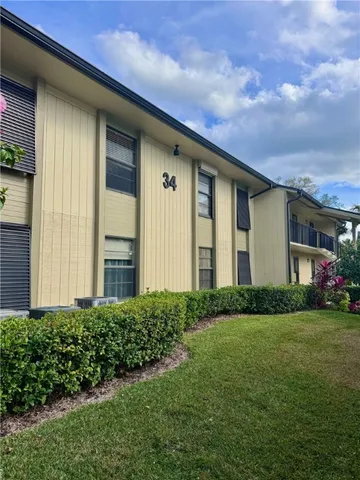 a view of a swimming pool with chairs