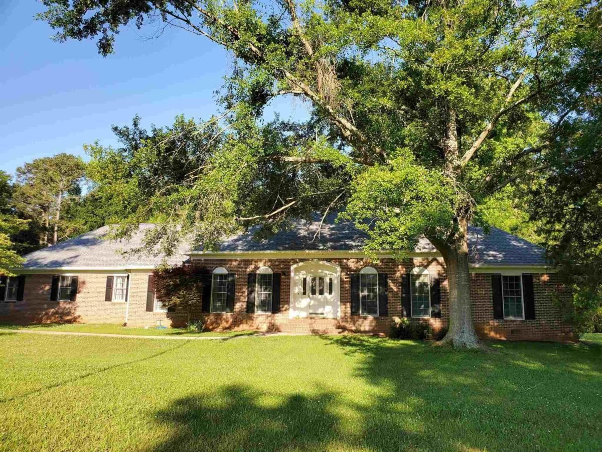 919 Madison Road Eatonton, GA 31024 - Photo 1 of 1 a front view of a house with a garden