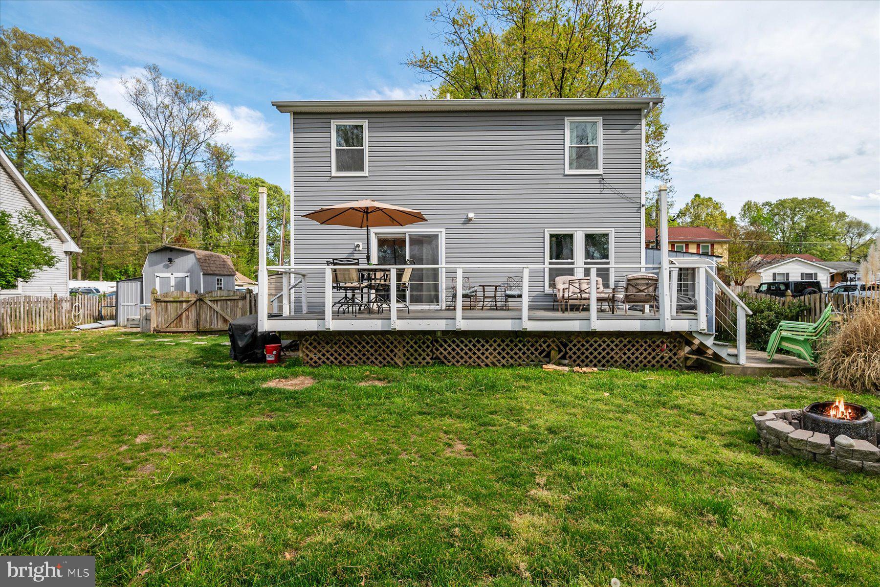 4904 Beech Street Shady Side, MD 20764 - Photo 12 of 26 a view of a house with backyard and sitting area