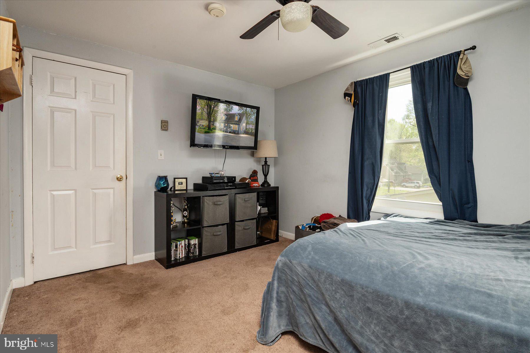 4904 Beech Street Shady Side, MD 20764 - Photo 19 of 26 a bedroom with a bed and a window