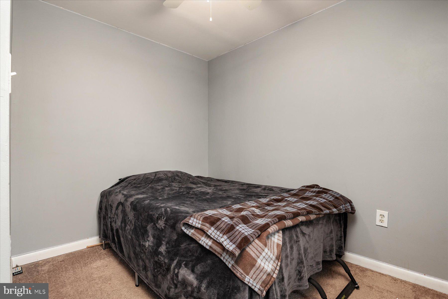 4904 Beech Street Shady Side, MD 20764 - Photo 20 of 26 a bedroom with a bed and a window