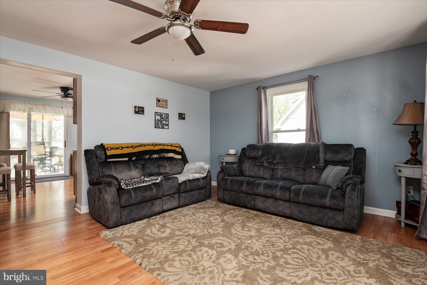 4904 Beech Street Shady Side, MD 20764 - Photo 4 of 26 a living room with furniture and a wooden floor