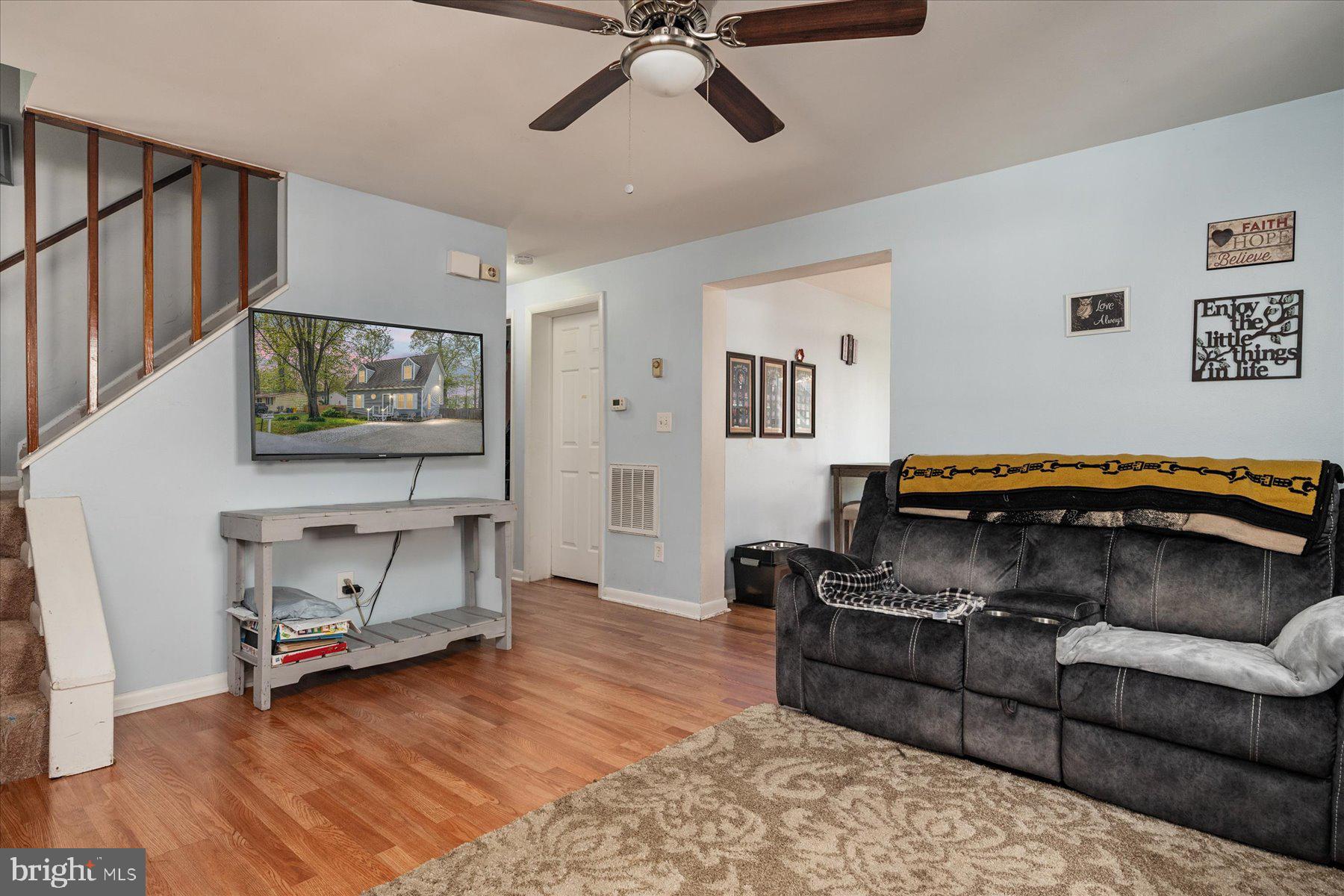 4904 Beech Street Shady Side, MD 20764 - Photo 6 of 26 a living room with furniture and a flat screen tv