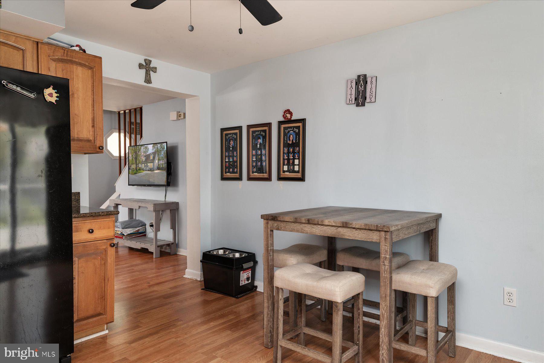 4904 Beech Street Shady Side, MD 20764 - Photo 7 of 26 a view of a dining room with furniture and wooden floor