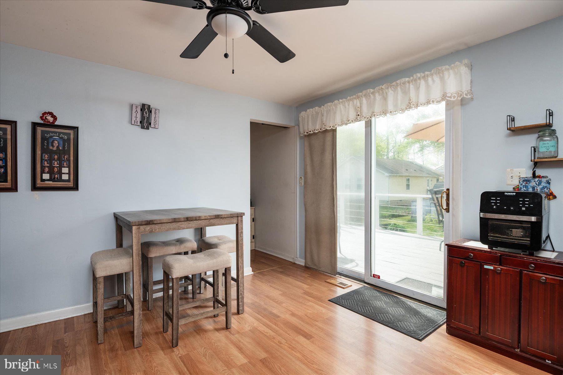 4904 Beech Street Shady Side, MD 20764 - Photo 8 of 26 a view of a livingroom with furniture window and wooden floor