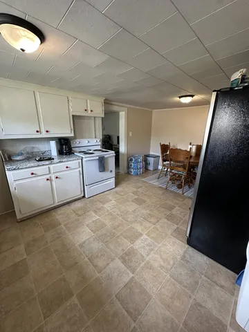 a bedroom with two beds and a window