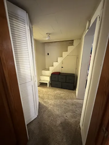 a bathroom with a sink mirror vanity and toilet