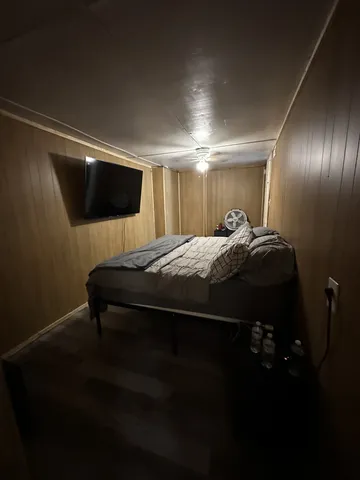 a bathroom with a sink a toilet a mirror and shower