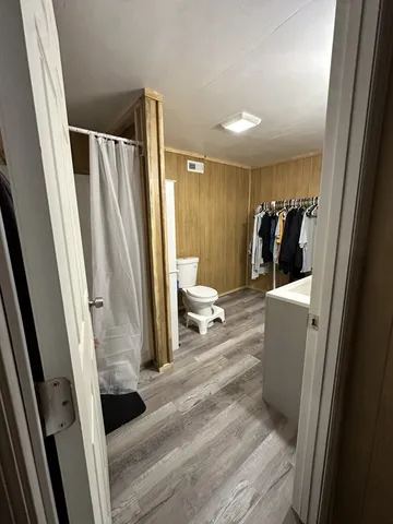 a view of utility room with two washing machine