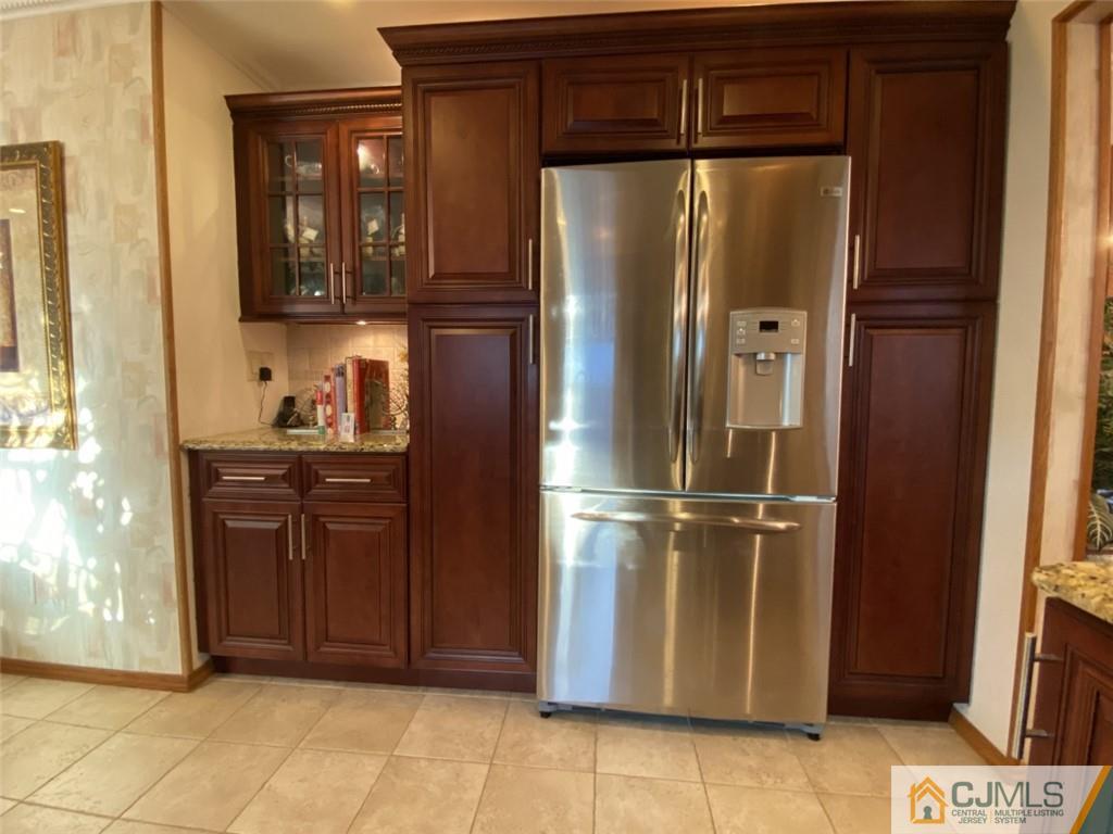 58 Brookside Road Edison, NJ 08817 - Photo 10 of 34 a kitchen with stainless steel appliances granite countertop a refrigerator and a cabinets