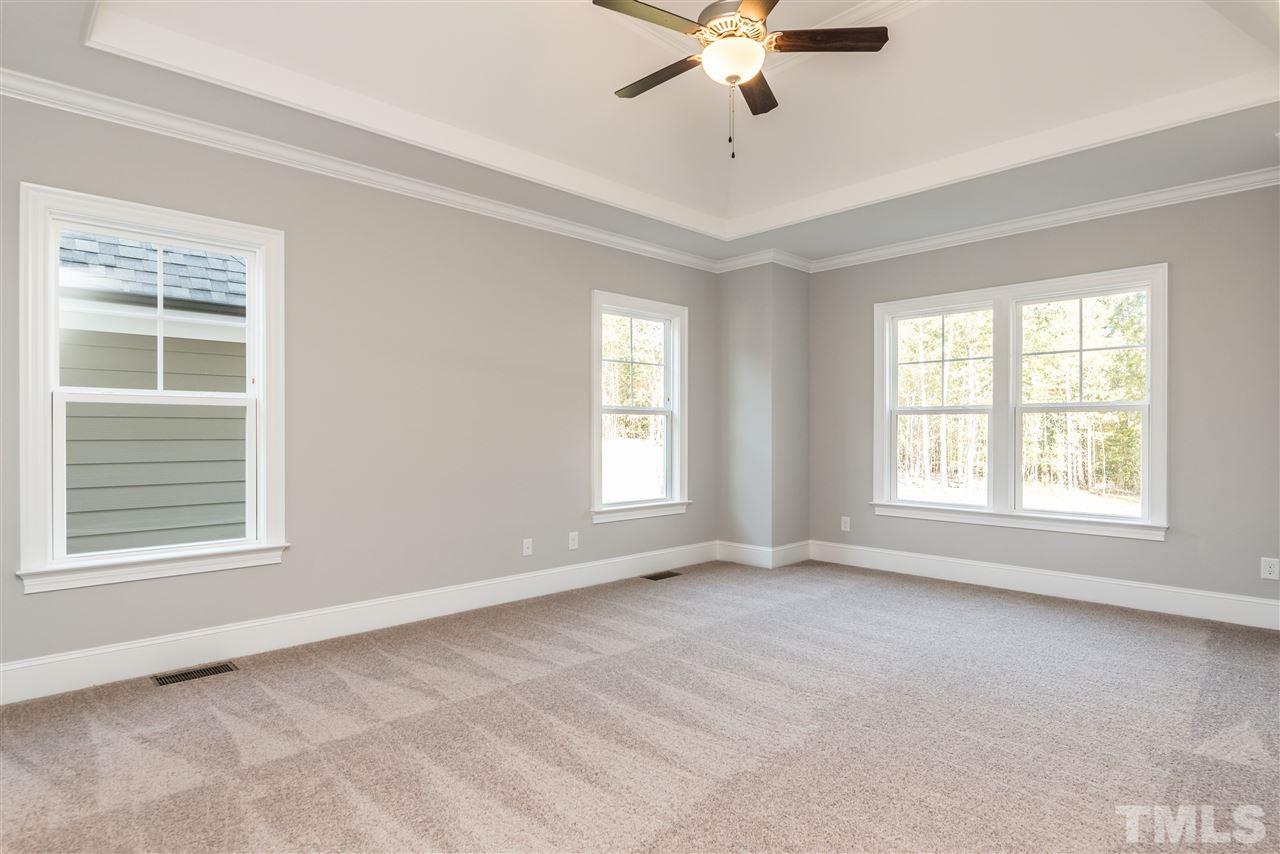 1121 Harrison Ridge Road Wake Forest, NC 27587 - Photo 14 of 25 a view of an empty room with a window