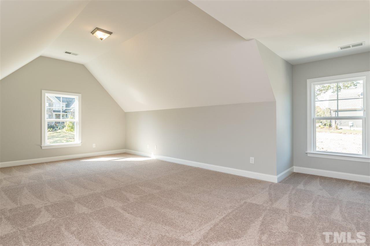 1121 Harrison Ridge Road Wake Forest, NC 27587 - Photo 22 of 25 an empty room with windows and closet