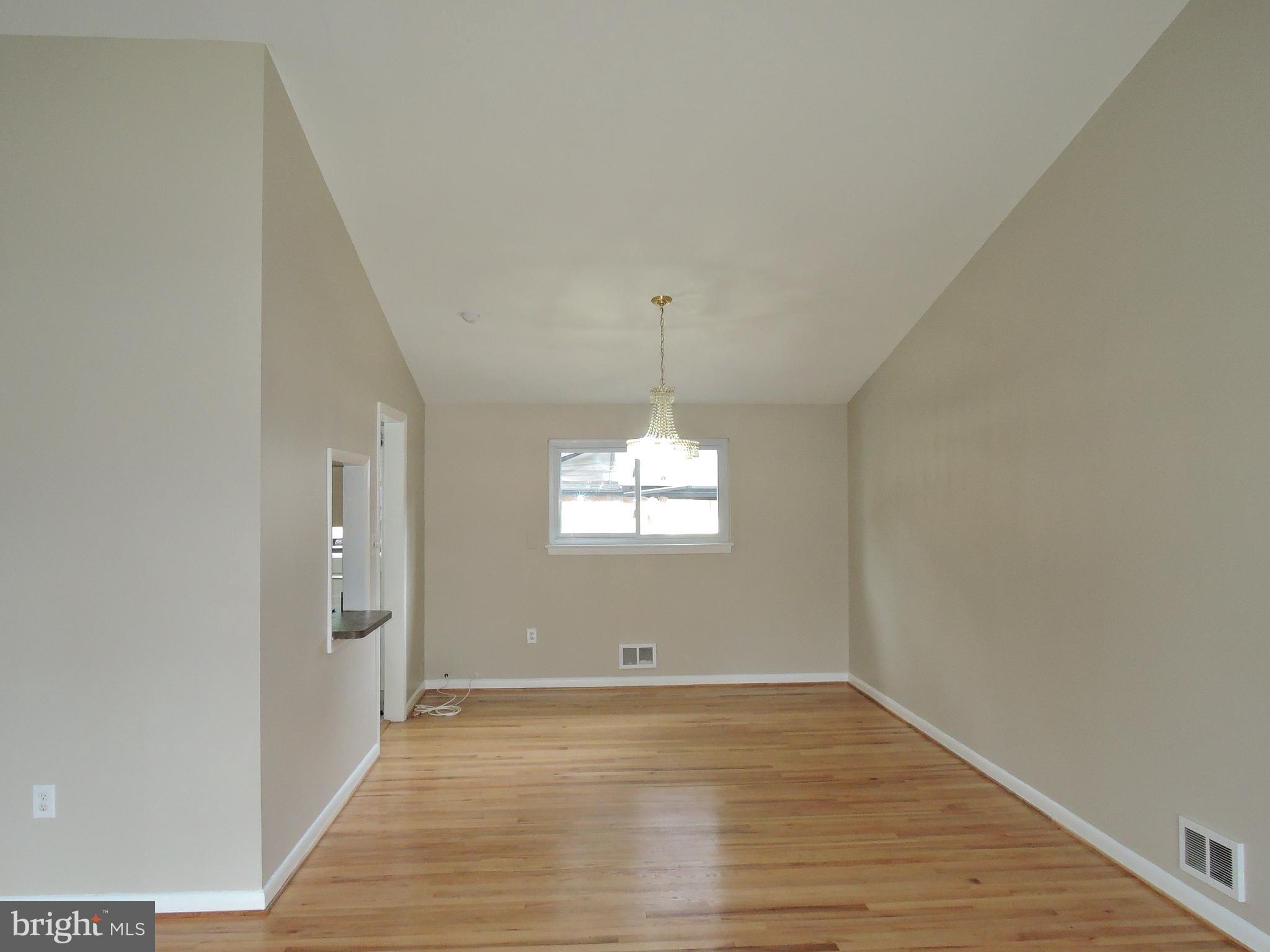 7518 Shelowood Road Baltimore, MD 21208 - Photo 9 of 22 Living Room Open to Dining Room