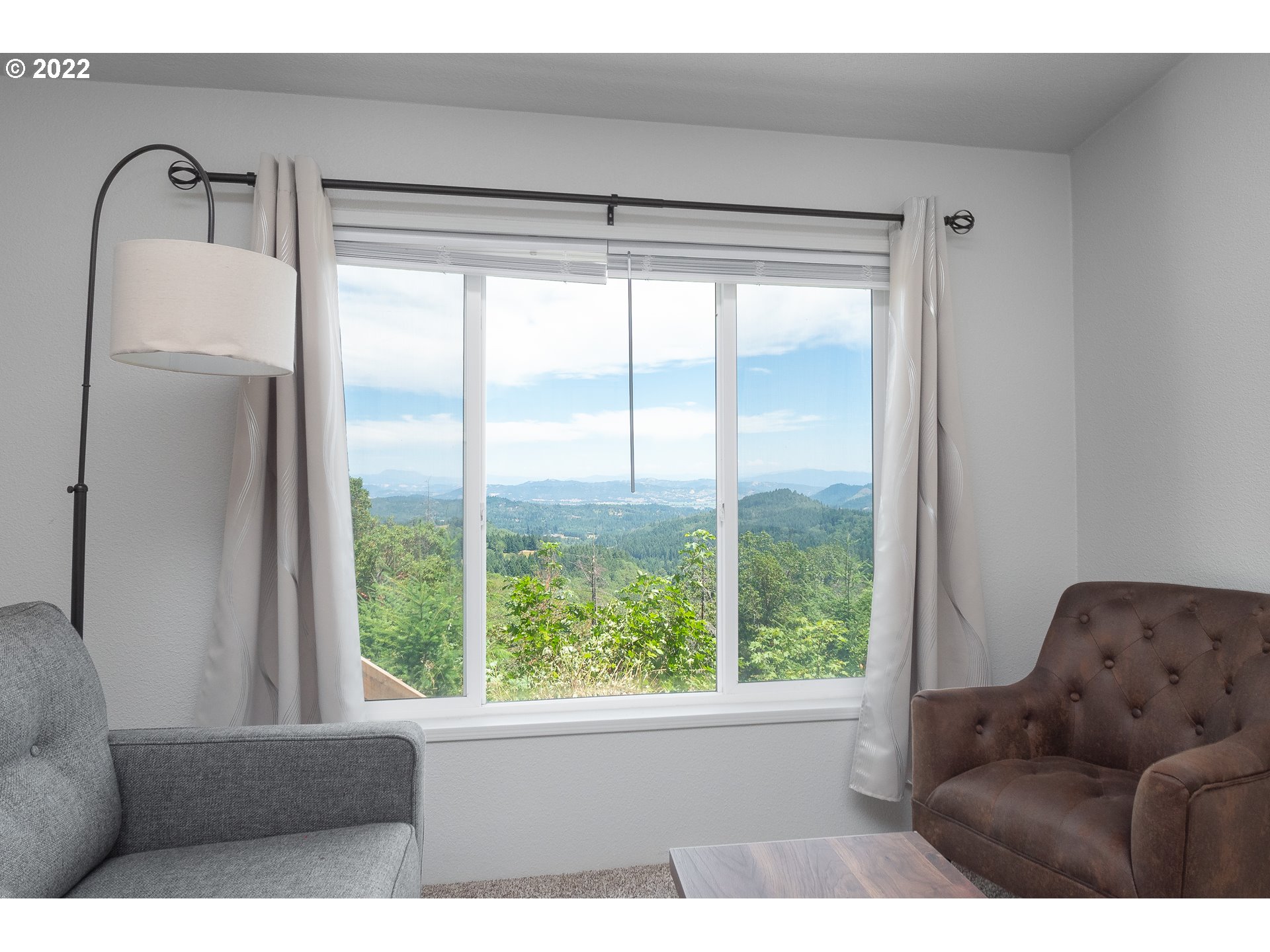 1499 Callahan Road Roseburg, OR 97471 - Photo 14 of 32 a living room with furniture and a large window