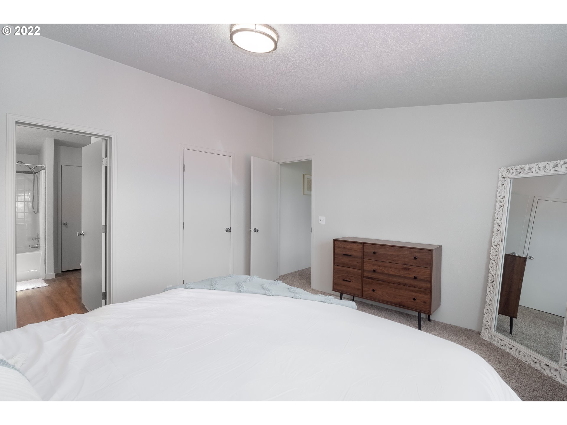 1499 Callahan Road Roseburg, OR 97471 - Photo 22 of 32 a bedroom with a bed and wooden floor