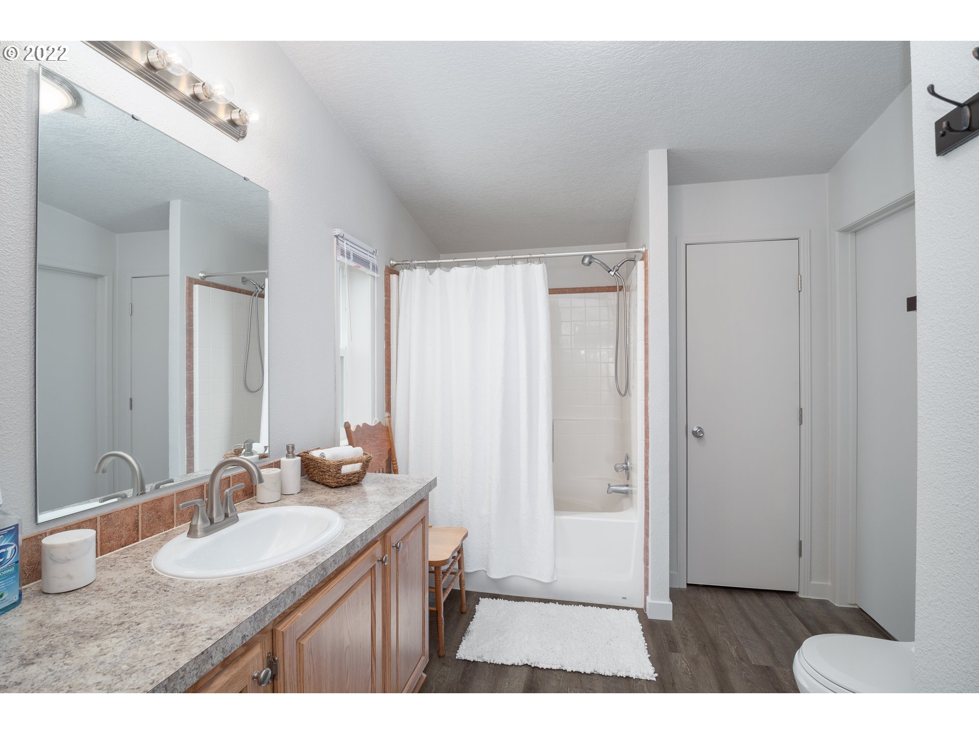 1499 Callahan Road Roseburg, OR 97471 - Photo 23 of 32 a bathroom with a granite countertop sink and a mirror