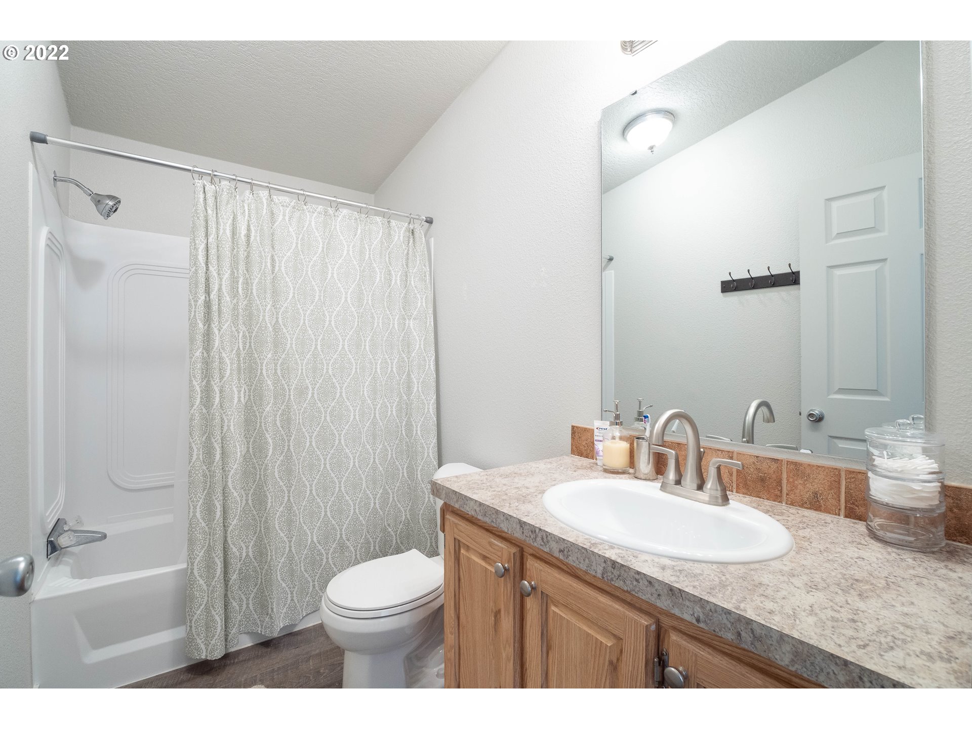 1499 Callahan Road Roseburg, OR 97471 - Photo 27 of 32 a bathroom with a granite countertop sink toilet and shower