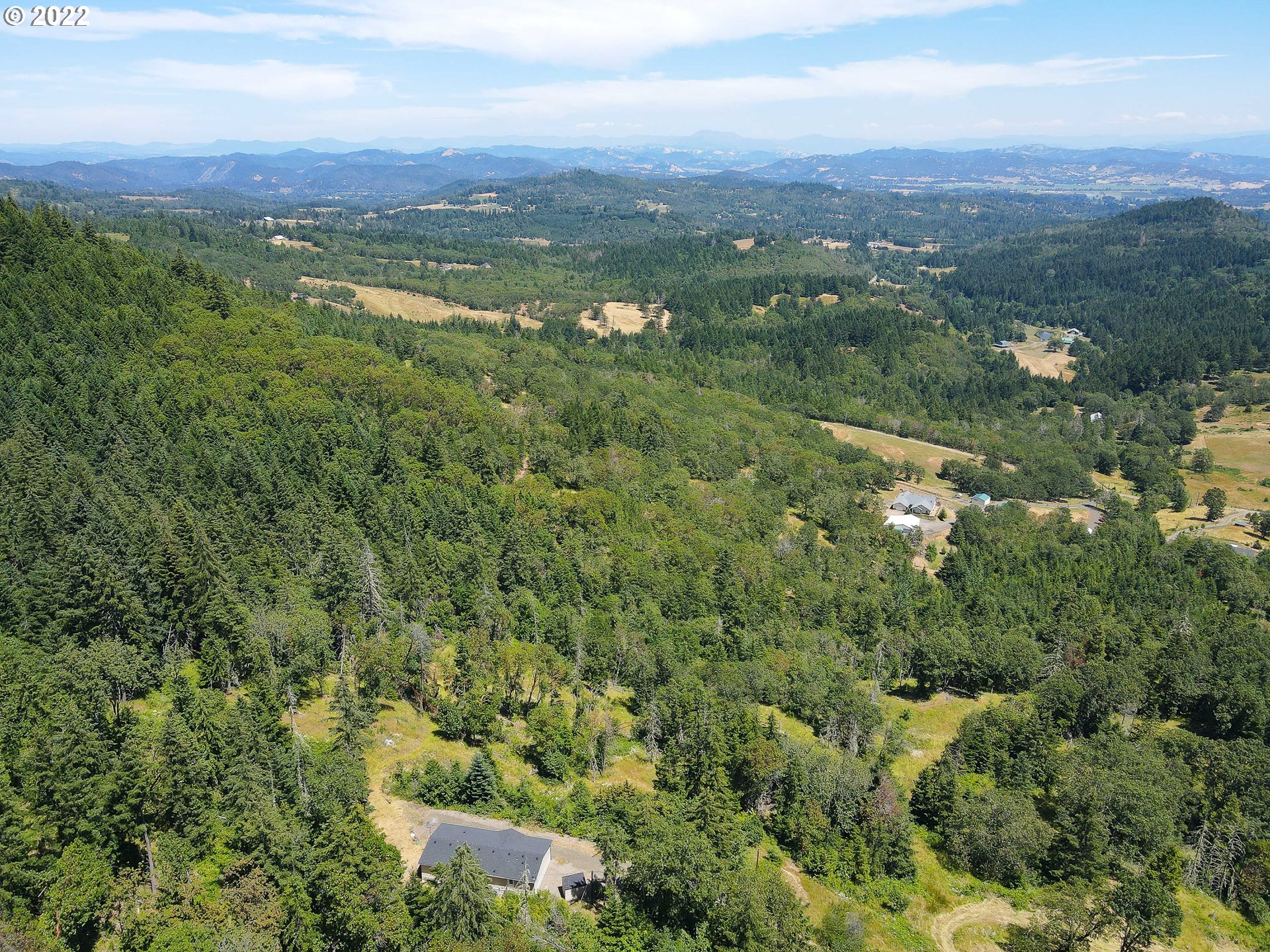 1499 Callahan Road Roseburg, OR 97471 - Photo 10 of 32 an aerial view of residential houses with outdoor space and trees