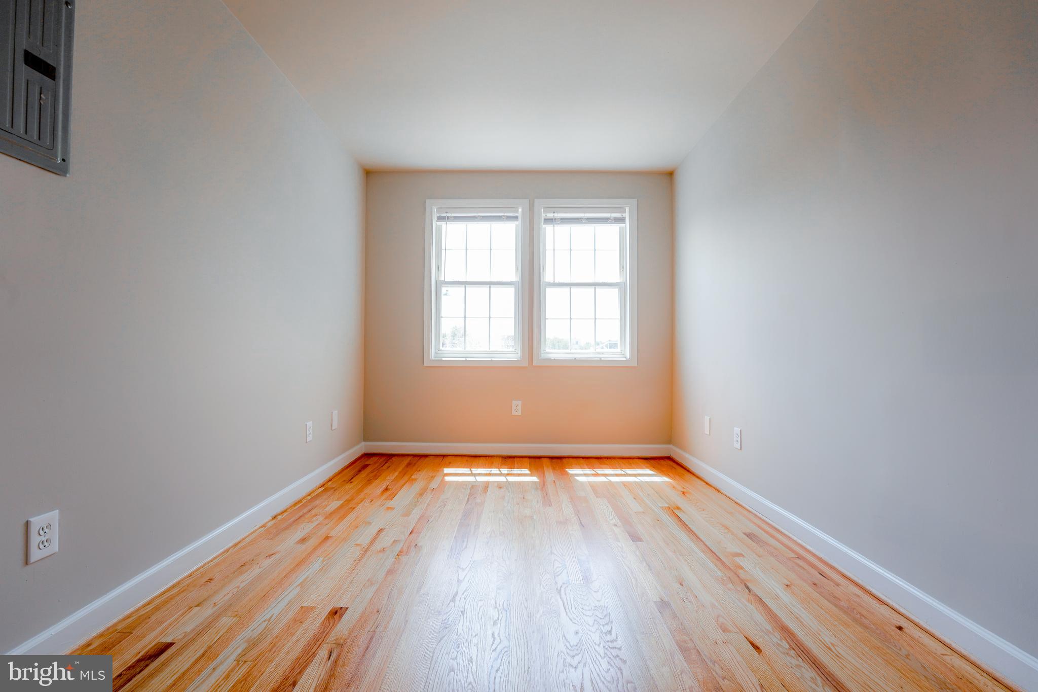 1823 H Place Northeast, Unit 3 Washington, DC 20002 - Photo 11 of 16 a view of a room with wooden floor and window