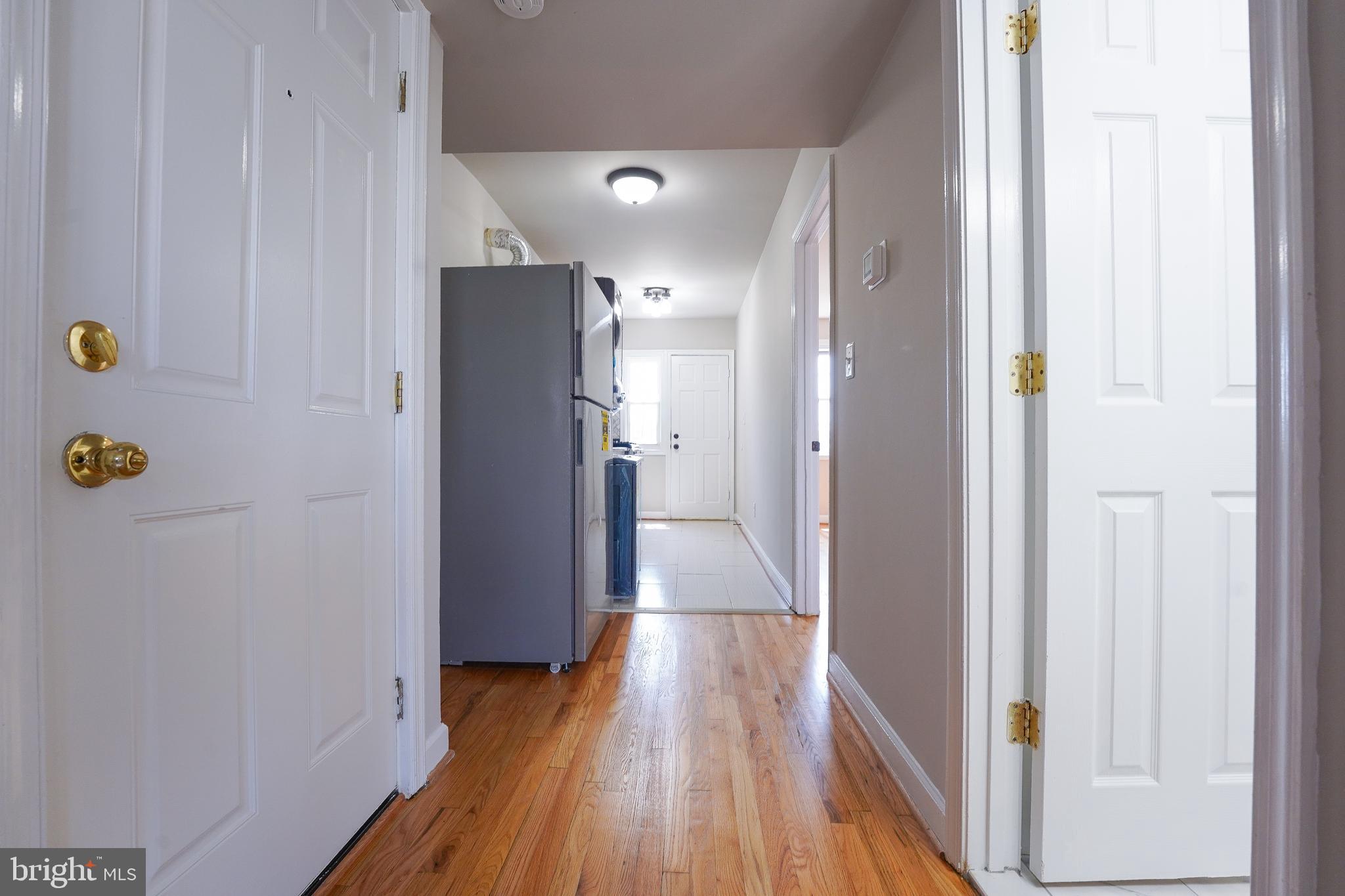 1823 H Place Northeast, Unit 3 Washington, DC 20002 - Photo 5 of 16 a view of hallway with wooden floor
