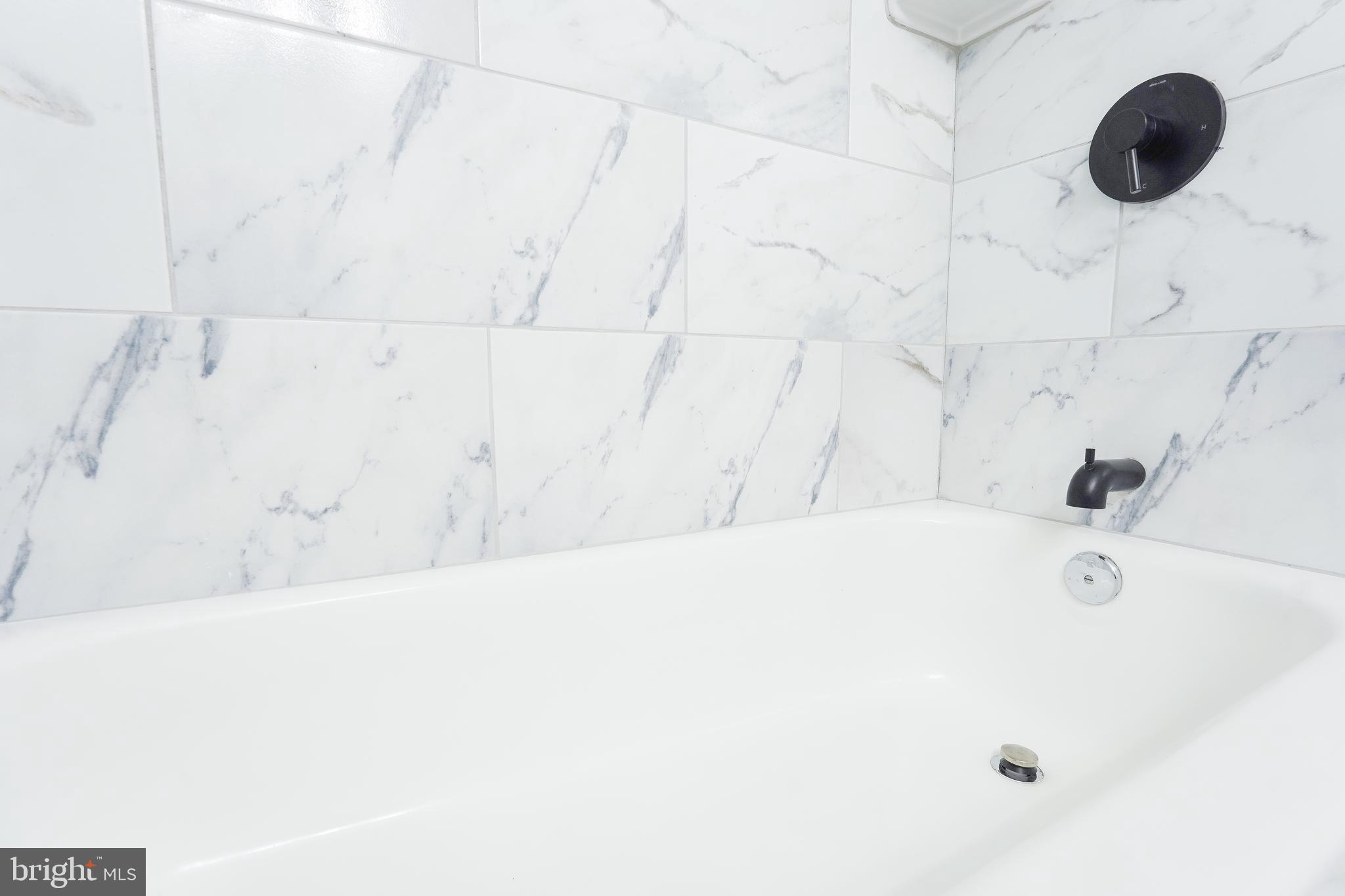 1823 H Place Northeast, Unit 3 Washington, DC 20002 - Photo 9 of 16 a bathroom with a tub