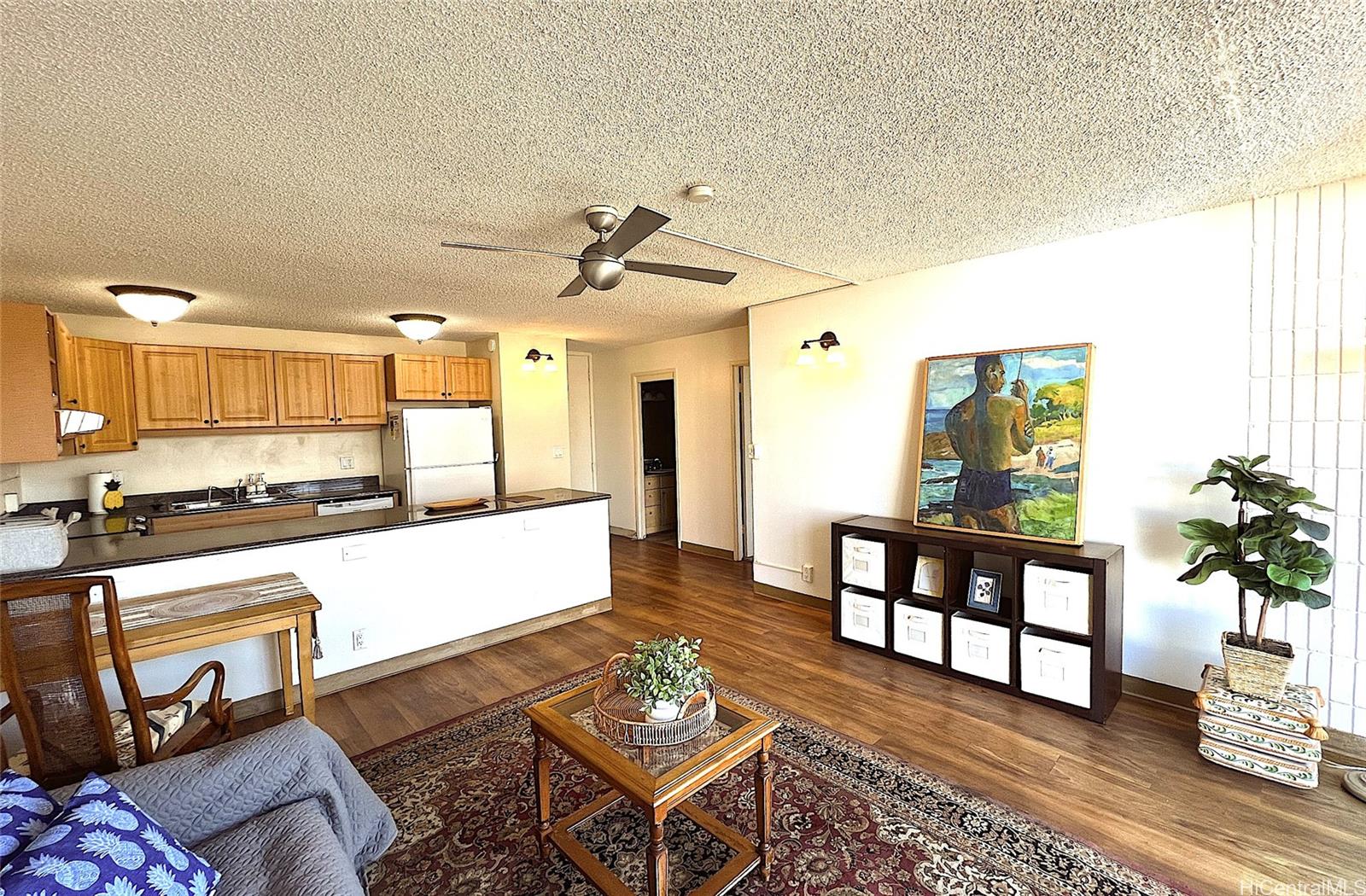 827 Kinau Street, Unit D106 Honolulu, HI 96813 - Photo 1 of 1 a living room with furniture and a dining table with wooden floor