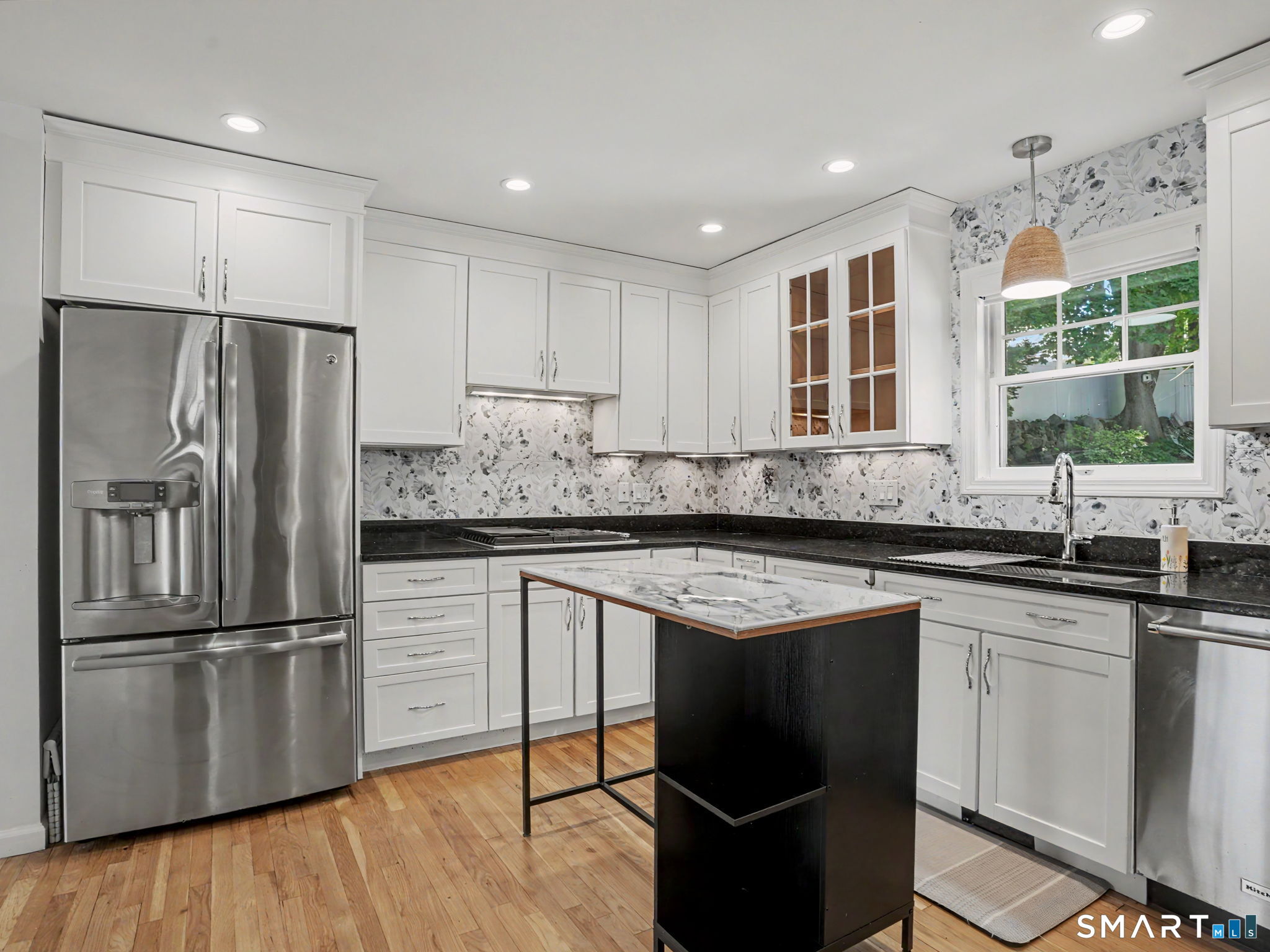 26 Abbott Avenue Ridgefield, CT 06877 - Photo 6 of 40 Newly designed kitchen with new porcelain backsplash, stainless steel appliances and freshly painted cabinets
