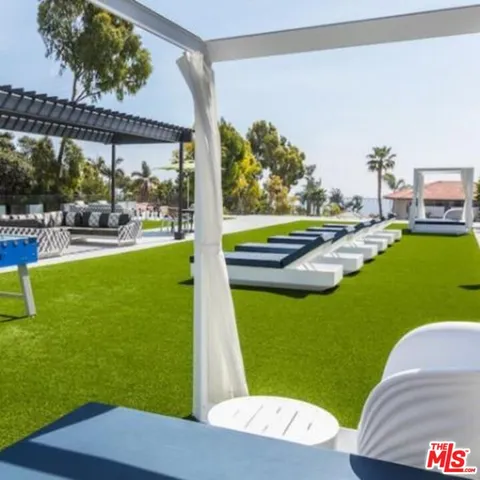 a patio with table and chairs