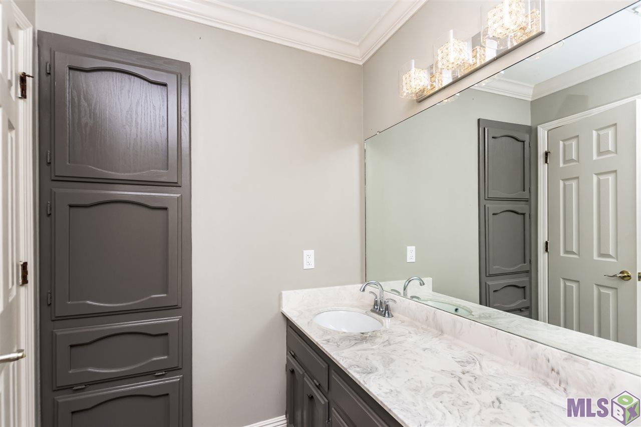 3635 East Nic Drive Addis, LA 70710 - Photo 15 of 21 Hall Bath with Laundry Access Cabinets